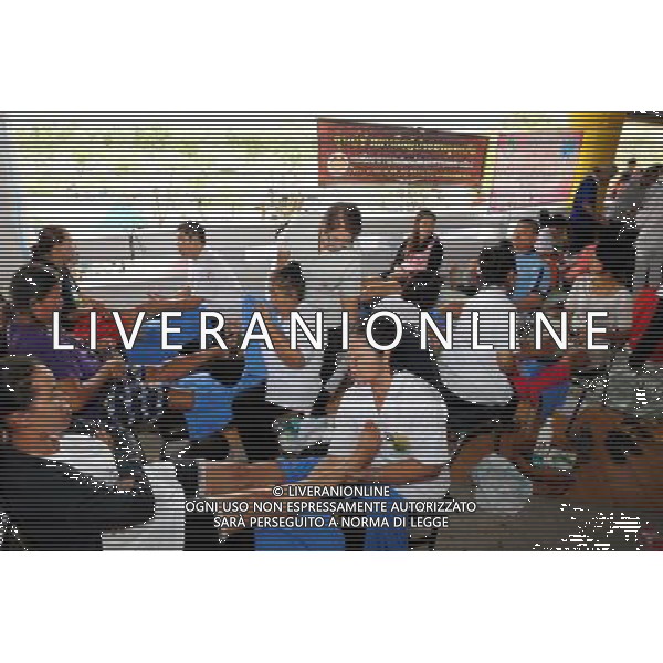 (111013) BANGKOK, Oct. 13, 2011 () People are given massages at a temporary shelter for people displaced by floods, at Thammasat University Convention Center in Thailand\'s capital Bangkok on Oct. 13, 2011. A total of 283 people were confirmed dead and two others were missing in the floods that have inundated the upper part of the country for almost three months, the Disaster Prevention and Mitigation Department reported on Thursday. (/Song Zhenping) (nxl)