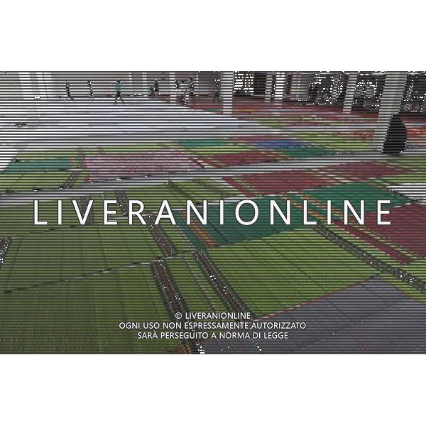 (111013) BANGKOK, Oct. 13, 2011 () Volunteers prepare mattresses for newcomers at a temporary shelter for people displaced by floods, at Thammasat University Convention Center in Thailand\'s capital Bangkok on Oct. 13, 2011. A total of 283 people were confirmed dead and two others were missing in the floods that have inundated the upper part of the country for almost three months, the Disaster Prevention and Mitigation Department reported on Thursday. (/Song Zhenping) (nxl)