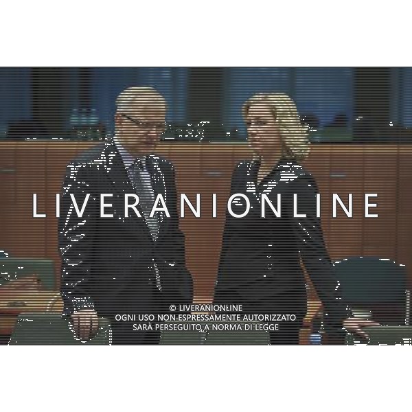 Olli Rehn the Monetary Affairs European Commissioner chats with Finnish Finance Minister Jutta Urpilainen during a meeting of eurozone finance ministers in Brussels, Belgium on 2011-10-21 The chairman of the eurogroup of finance ministers says the delay to a debt crisis creates a \'disastrous\' image of the eurozone to the outside world. Jean-Claude Juncker, who is also the prime minister of Luxembourg, added that it\'s not necessarily just France and Germany that have differences of opinion on how to tackle the crisis. by Wiktor Dabkowski - Photoshot - Ag. Aldo Liverani sas ITALY ONLY BRUXELLES - MEETING DEI MINISTRI DELLE FINANZE DELLA ZONA EURO
