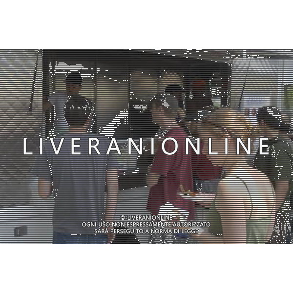Customers wait on line for Salvadorian food at the Latin food vendors in the Red Hook neighborhood of Brooklyn in New York. The popular vendors sell cuisine from various Latin American countries out of a corner of Red Hook Park. Due to city health regulations, the vendors, who used to operate out of tents, had to purchase trucks and pass inspection at considerable cost. The businesses started over 30 years ago near the soccer fields in the park that are popular with Hispanic immigrants. new york city - situazioni ©photoshot/AG ALDO LIVERANI SAS ITALY ONLY