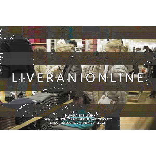 Customers shop at the grand opening of the Uniqlo store on West 34th street in New York on Friday, October 21, 2011. The new store is Fast Retailing\'s third store in New York, opening just a week after its Fifth Avenue flagship store. Fast Retailing plans on opening 200 to 300 stores worldwide until 2020 and currently has 1000 stores. new york city - situazioni ©photoshot/AG ALDO LIVERANI SAS ITALY ONLY