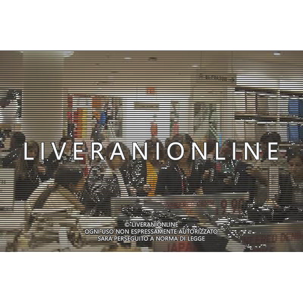 Customers shop at the grand opening of the Uniqlo store on West 34th street in New York on Friday, October 21, 2011. The new store is Fast Retailing\'s third store in New York, opening just a week after its Fifth Avenue flagship store. Fast Retailing plans on opening 200 to 300 stores worldwide until 2020 and currently has 1000 stores. new york city - situazioni ©photoshot/AG ALDO LIVERANI SAS ITALY ONLY