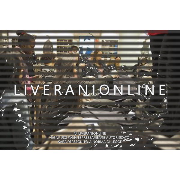 Customers shop at the grand opening of the Uniqlo store on West 34th street in New York on Friday, October 21, 2011. The new store is Fast Retailing\'s third store in New York, opening just a week after its Fifth Avenue flagship store. Fast Retailing plans on opening 200 to 300 stores worldwide until 2020 and currently has 1000 stores. new york city - situazioni ©photoshot/AG ALDO LIVERANI SAS ITALY ONLY