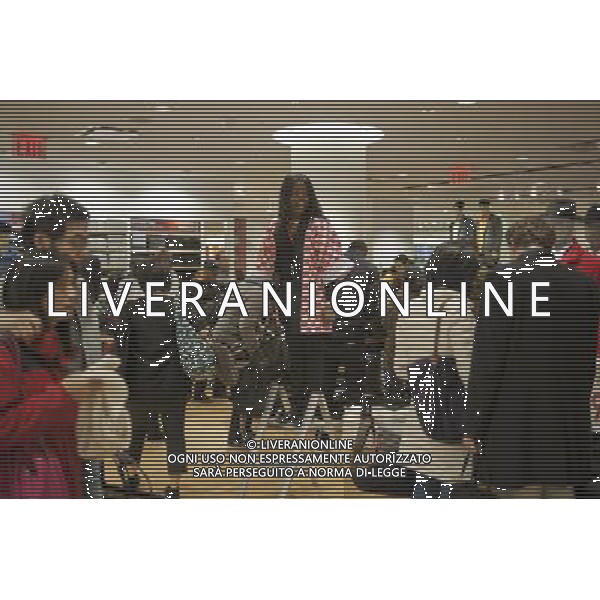 Customers shop at the grand opening of the Uniqlo store on West 34th street in New York on Friday, October 21, 2011. The new store is Fast Retailing\'s third store in New York, opening just a week after its Fifth Avenue flagship store. Fast Retailing plans on opening 200 to 300 stores worldwide until 2020 and currently has 1000 stores. new york city - situazioni ©photoshot/AG ALDO LIVERANI SAS ITALY ONLY