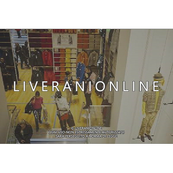 Customers shop at the grand opening of the Uniqlo store on West 34th street in New York on Friday, October 21, 2011. The new store is Fast Retailing\'s third store in New York, opening just a week after its Fifth Avenue flagship store. Fast Retailing plans on opening 200 to 300 stores worldwide until 2020 and currently has 1000 stores. new york city - situazioni ©photoshot/AG ALDO LIVERANI SAS ITALY ONLY