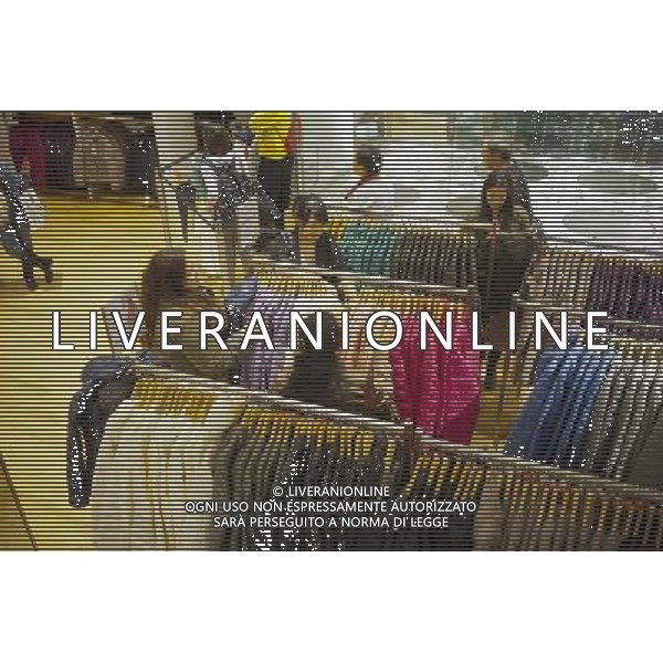 Customers shop at the grand opening of the Uniqlo store on West 34th street in New York on Friday, October 21, 2011. The new store is Fast Retailing\'s third store in New York, opening just a week after its Fifth Avenue flagship store. Fast Retailing plans on opening 200 to 300 stores worldwide until 2020 and currently has 1000 stores. new york city - situazioni ©photoshot/AG ALDO LIVERANI SAS ITALY ONLY