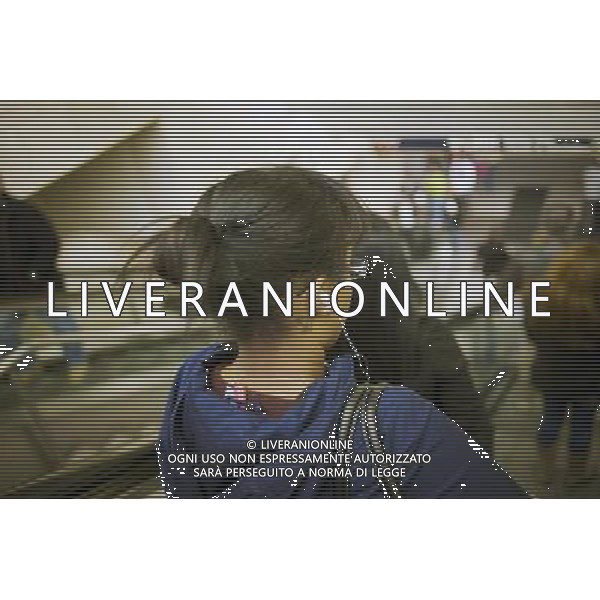 A woman separates herself from the rest of the world listening to her iPod on the subway in New York on Friday, October 21, 2011. The NYPD is warning commuters to watch and not to display their electronic devices on the subway due to a spike in thefts. new york city - situazioni ©photoshot/AG ALDO LIVERANI SAS ITALY ONLY