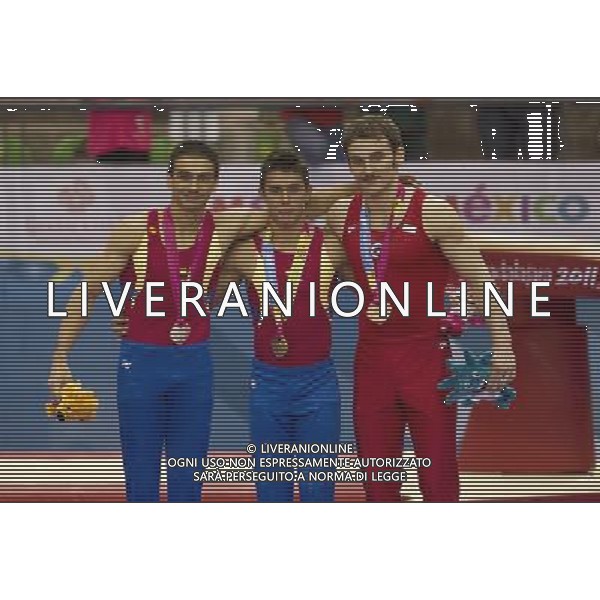 (111027) -- GUADALAJARA, Oct. 27, 2011 () -- Jose Hugo Gildardo (L), gold medalist of Colombia, Jossimar Orlando Calvo (C), silver medalist of Colombia, and Enrique Tomas Gonzales (R) of Chile, bronze medalist, pose for a photo after winning in the men\'s individual all-around artistic gymnastics competition during the Pan American Games Guadalajara 2011, at Nissan Gymnastics Complex, in Guadalajara, Jalisco, Mexico, on Oct. 26, 2011. (/Bao Feifei)