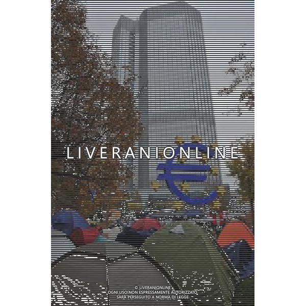 (111103) -- FRANKFURT, Nov. 3, 2011 () -- \'Occupy Frankfurt\' protesters camp outside the headquarters of European Central Bank (ECB) in Frankfurt, Germany, Nov. 3, 2011. ECB unexpectedly cut its benchmark interest rates to calm market turmoil on Thursday, as its new president warned the eurozone are facing \'particularly high uncertainties and intensified downside risks.\' (/Ma Ning) AG ALDO LIVERANI S A S ONLY ITALY