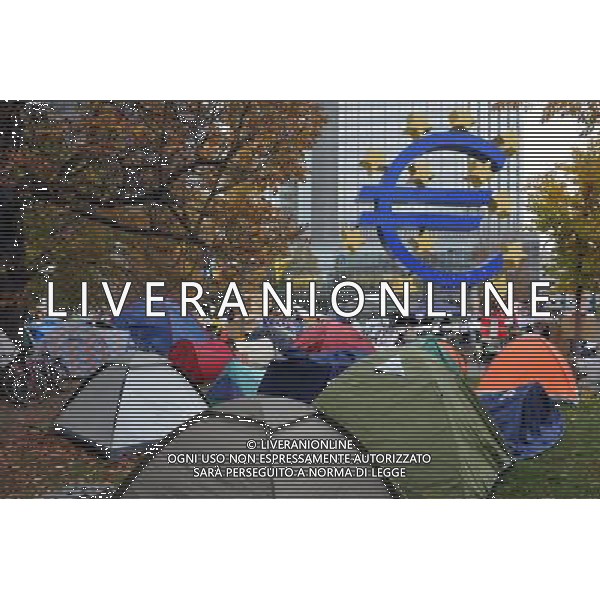 (111103) -- FRANKFURT, Nov. 3, 2011 () -- \'Occupy Frankfurt\' protesters camp outside the headquarters of European Central Bank (ECB) in Frankfurt, Germany, Nov. 3, 2011. ECB unexpectedly cut its benchmark interest rates to calm market turmoil on Thursday, as its new president warned the eurozone are facing \'particularly high uncertainties and intensified downside risks.\' (/Ma Ning) AG ALDO LIVERANI S A S ONLY ITALY