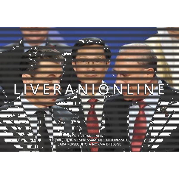 (111104) -- CANNES, NOV. 4, 2011 () -- French President Nicolas Sarkozy (L), Chinese Finance Minister Xie Xuren(C), Secretary General of the Organization for Economic Co-operation and Development (OECD) Angel Gurria (R) and finance ministers from G20 attend a commemorative photograph after the signing of the Convention on Fighting Tax Evasion during the G20 Summit in Cannes, South France, Nov. 4, 2011. (/Wu Wei)(msq) CANNES - IL G20 ©ag ALDO LIVERANI SAS - ITALY ONLY - *** Local Caption *** .