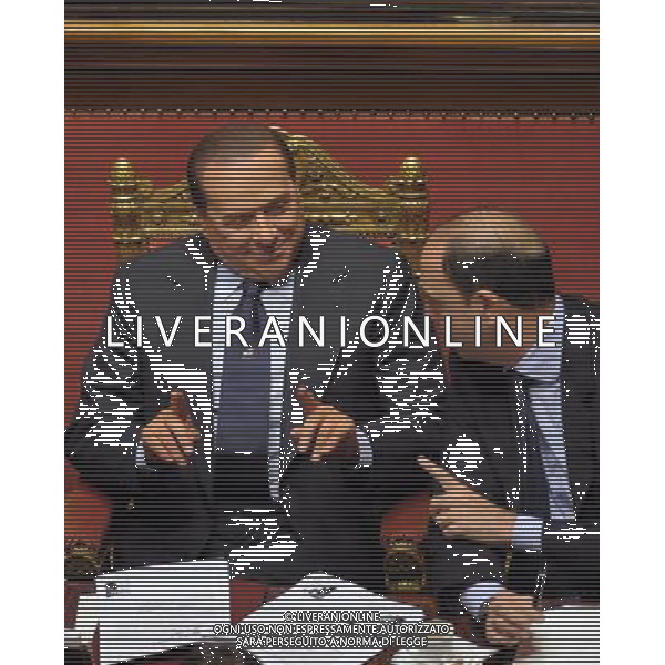 (111109) -- ROME, Nov. 9, 2011 () -- File photo taken on Dec. 14, 2010 shows Italian Prime Minister Silvio Berlusconi (L) and then Justice Minister Angelino Alfano talk during a confidence vote at the Senate in Rome, Italy. Berlusconi confirmed Wednesday he will not run again for office and nominated Angelino Alfano, head of his People of Liberties Party, as successor. (/Wang Qingqin) (zx) ©photoshot/AG ALDO LIVERANI SAS - ITALY ONLY