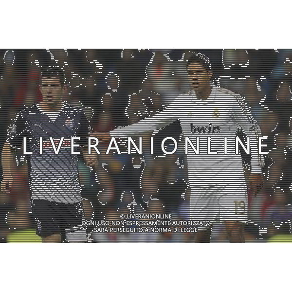 Real Madrid\'s Raphael Varane and Dinamo de Zagreb\'s Fatos Beqiraj during Champions League match on november 22nd, 2011 Photo: Cid-Fuentes / Cebolla / ALFAQUI /AG ALDO LIVERANI REAL MADRID DINAMO ZAGABRIA CHAMPIONS LEAGUE - ITALY ONLY -