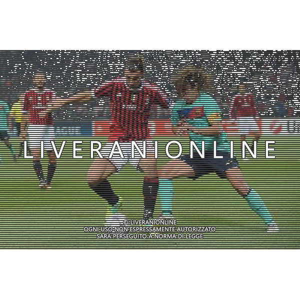 UEFA Champions League - Fase a Gironi 5Á giornata Gruppo H Milano 23-11-2011 Milan - Barcellona nella foto: Zlatan Ibrahimovic (Milan) a SX e Carles Puyol (Barcellona) foto Roberto Garavaglia - ag. Aldo Liverani sas