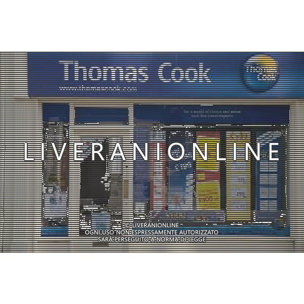 Jobs fears as Thomas Cook merges with Co-op travel agency. Travel agents Thomas Cook and the Co-operative will merge their high street travel businesses in a move expected to cost hundereds of jobs. With more than 1200 branches in the UK the new company will be the UK\'s largest travel agent.Both branches are at present in the High Street Bangor N Wales ©photoshot/Agenzia Aldo Liverani Sas - ITALY ONLY - Thomas Cook tour operator britannico con oltre 1200 Agenzie Viaggi nel Regno Unito ha fatto sapere di essere alla ricerca di nuovi capitali per sostenere un notevole rallentamento nel volume degli affari che ha fatto lievitare i debiti infatti alla borsa di Londra, il titolo della societa\' britannica registra un calo del 70%