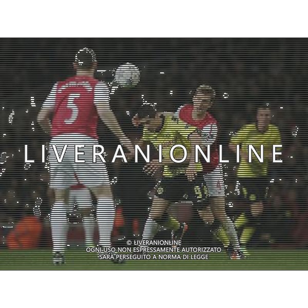 Borussia Dortmund\'s Robert Lewandowski battles with Arsenal\'s Per Mertesacker Football - UEFA Champions League - Group F - Arsenal London v Borussia Dortmund - Wed 23 Nov 2011 - Emirates Stadium - London - UK Foto: Michal Zemanek / Newspix.pl --- Newspix.pl AG ALDO LIVERANI S A S ONLY ITALY *** Local Caption *** www.newspix.pl mail us: info@newspix.pl call us: 0048 022 23 22 222 --- Polish Picture Agency by Ringier Axel Springer Poland