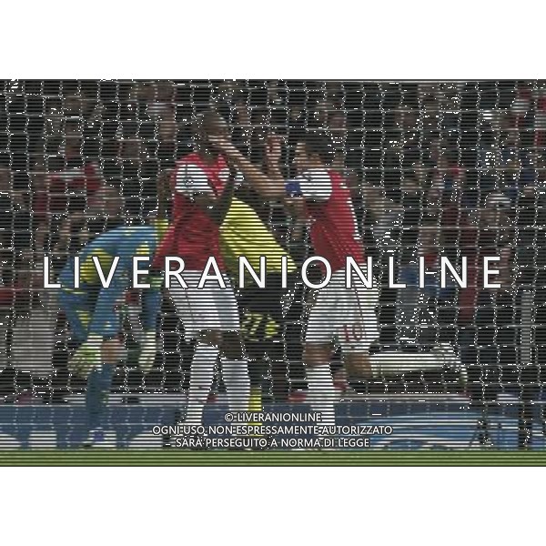 Arsenal\'s Robin van Persie celebrates scoring his sides second goal with team-mate Abou Diaby Football - UEFA Champions League - Group F - Arsenal London v Borussia Dortmund - Wed 23 Nov 2011 - Emirates Stadium - London - UK Foto: Michal Zemanek / Newspix.pl --- Newspix.pl AG ALDO LIVERANI S A S ONLY ITALY *** Local Caption *** www.newspix.pl mail us: info@newspix.pl call us: 0048 022 23 22 222 --- Polish Picture Agency by Ringier Axel Springer Poland