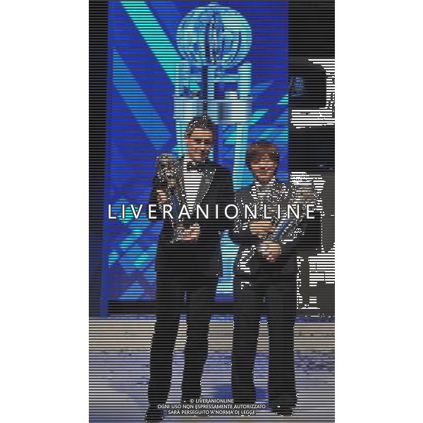 (111123) -- KUALA LUMPUR, Nov. 23, 2011 () -- AFC player of the year 2011 Server Djeparov (L) of Uzbekistan and AFC Woman Player of the Year 2011 Aya Miyama of Japan pose with their trophies during the AFC Annual Awards 2011 in Kuala Lumpur, Malaysia, Nov. 23, 2011. (/Chong Voon Chung) (jyc) AG ALDO LIVERANI S A S ONLY ITALY