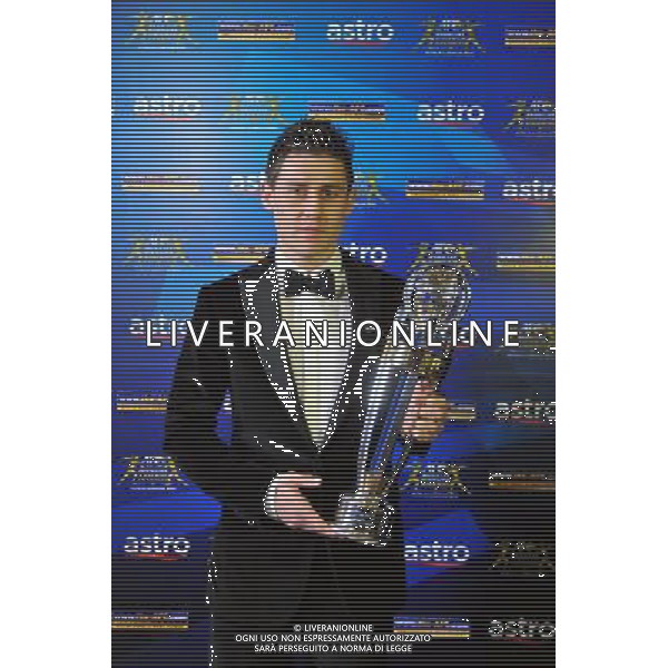 (111123) -- KUALA LUMPUR, Nov. 23, 2011 () -- AFC player of the year 2011 Server Djeparov of Uzbekistan holds his trophy during the AFC Annual Awards 2011 in Kuala Lumpur, Malaysia, Nov. 23, 2011. (/Chong Voon Chung) (jyc) AG ALDO LIVERANI S A S ONLY ITALY