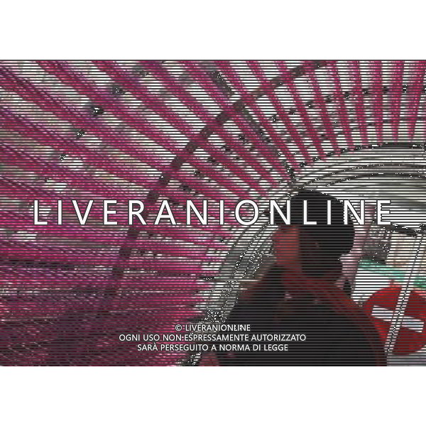 (111130) -- PARIS, Nov. 30, 2011 () -- A visitor watches the exhibition \'Sounds of my life\' by Ireland\'s artist Bryan McCormack at the Georges Pompidou art center in Paris, France, on Nov. 30, 2011. The exhibition shows coloured plastic condoms at all floors of Georges Pompidou Center as part of a campaign to fight against AIDS. (/Gao Jing) - Xinhua/Photoshot - Ag.Aldo Liverani sas ITALY ONLY PARIGI - CENTRE GEORGES POMPIDOU: MOSTRA DELL\'ARTISTA IRLANDESE BRYAN McCORMACK, RAFFIGURA PROFILATTICI COLORATI COME CAMPAGNA PER LA LOTTA CONTRO L\'AIDS.