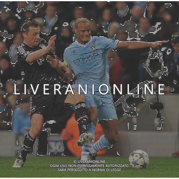 Manchester City\'s Vincent Kompany and Bayern Munich\'s Ivica Olic battle for the ball Football - UEFA Champions League Group A - Manchester City v Bayern Munich - Wed 07 Dec 2011 - Etihad Stadium - Manchester Œ© CameraSport - 43 Linden Ave. Countesthorpe. Leicester. England. LE8 5PG - Tel: +44 (0) 116 277 4147 - admin@camerasport.com - www.camerasport.com ©AG ALDO LIVERANI SAS - ITALY ONLY *** Local Caption *** .