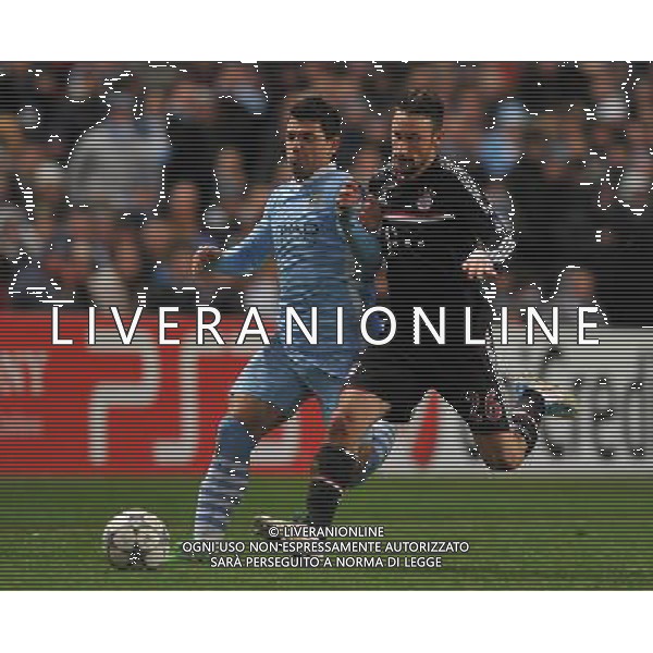 Manchester City\'s Sergio Aguero and Bayern Munich\'s Diego Contento battle for the ball Football - UEFA Champions League Group A - Manchester City v Bayern Munich - Wed 07 Dec 2011 - Etihad Stadium - Manchester Œ© CameraSport - 43 Linden Ave. Countesthorpe. Leicester. England. LE8 5PG - Tel: +44 (0) 116 277 4147 - admin@camerasport.com - www.camerasport.com ©AG ALDO LIVERANI SAS - ITALY ONLY *** Local Caption *** .