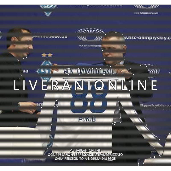 (111213) -- KIEV, Dec. 13, 2011 () -- President of Ukrainian football club Dynamo Kiev Ihor Surkis (R) displays a jersey marking the 88th anniversary of Olympic arena stadium in Kiev, Dec. 12, 2011. Ukrainian football club Dynamo Kiev and Olympic arena stadium announced Monday that a contact has been signed whereby Dynamo will play all of their home games at the renewed Olympic Stadium in the next 5 years. (/Olga Tarnavskaya)(xnz) AG ALDO LIVERANI S A S ONLY ITALY