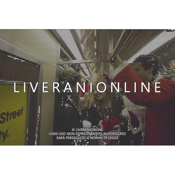 Christmas revelers participating in the annual Santacon travel on the subway in New York on Saturday, December 10, 2011. Santacon, primarily a pub crawl in Santa and other Christmas related costumes, attracts hundreds of masqueraders going from bar to bar. The drinkers were encouraged to imbibe at establishments which are participating in Toys For Tots and the NYPD reported that not a single Santa was arrested. (å Richard B. Levine) Photo via Newscom ©photoshot/AG ALDO LIVERANI SAS - ITALY ONLY