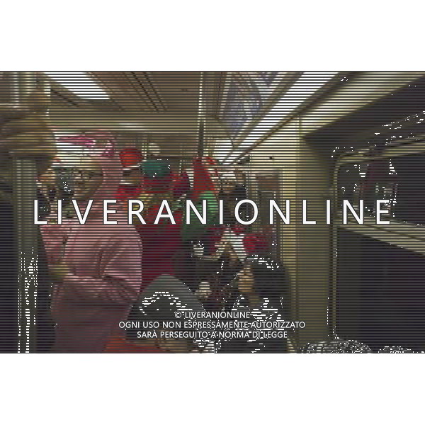 Christmas revelers participating in the annual Santacon travel on the subway in New York on Saturday, December 10, 2011. Santacon, primarily a pub crawl in Santa and other Christmas related costumes (except of one participant who got his holidays mixed up), attracts hundreds of masqueraders going from bar to bar. The drinkers were encouraged to imbibe at establishments which are participating in Toys For Tots and the NYPD reported that not a single Santa was arrested. (å Richard B. Levine) Photo via Newscom ©photoshot/AG ALDO LIVERANI SAS - ITALY ONLY