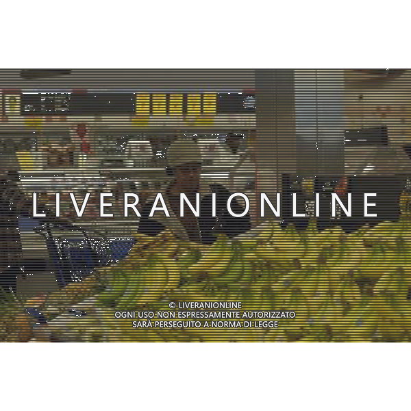 A shopper browses the bananas in the produce section of the Pathmark supermarket in Harlem in New York on Thursday, April 2, 2009. ( Richard B. Levine) Photo via Newscom ©photoshot/AG ALDO LIVERANI SAS - ITALY ONLY