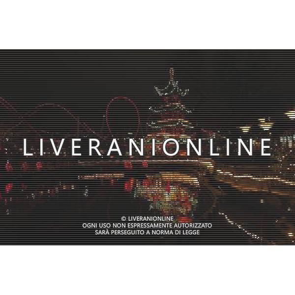 (111221) -- COPENHAGEN, Dec. 21, 2011 () -- A Chinese style pagoda is seen decorated with lights in Tivoli Garden for the upcoming Christmas in Copenhagen, Denmark, Dec. 20, 2011. (/Wu bo) (zf) ©PHOTOSHOT/ALDO LIVERANI SAS - ITALY ONLY -