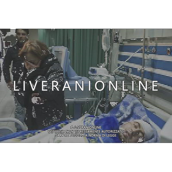 (111229) -- DAMASCUS, Dec. 29, 2011 () -- A woman cries as his son remains unconscious after being attacked at a hospital in Homs, Syria, Dec. 29, 2011. Mohammad Mustafa al-Dabi, the head of Arab League (AL) observer mission, told the private Addounia TV on Wednesday that the situation in Homs is \'placatory till now,\' and has unequivocally confessed the presence of \'gunmen\' in the city. (/Li Muzi) /photoshot/AG ALDO LIVERANI SAS - ITALY ONLY