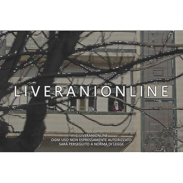 (111229) -- DAMASCUS, Dec. 29, 2011 () -- A woman looks out from her balcony in Homs, Syria, Dec. 29, 2011. Mohammad Mustafa al-Dabi, the head of Arab League (AL) observer mission, told the private Addounia TV on Wednesday that the situation in Homs is \'placatory till now,\' and has unequivocally confessed the presence of \'gunmen\' in the city. (/Li Muzi) /photoshot/AG ALDO LIVERANI SAS - ITALY ONLY
