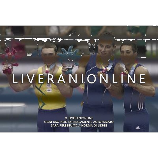 (111028) GUADALAJARA, Oct. 28, 2011 () Gold medalist Brandon Ross Wynn (C) of the U.S., silver medalist Arthur Zanetti (L) of Brazil and bronze medalist Christopher Maestas (R) of the U.S. celebrate after the awarding ceremony of the men\'s rings final of the artistic gymnastics competition during the Pan American Games Guadalajara 2011, at Nissan Gymnastics Complex, in Guadalajara, Jalisco, Mexico, on Oct. 27, 2011. (/Bao Feifei) (py) ©photoshot/Agenzia Aldo Liverani Sas - ITALY ONLY - Giochi Panamericani di Guadalajara 2011, presso Palestra polivalente, in Guadalajara, Jalisco, Messico