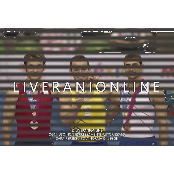 (111028) GUADALAJARA, Oct. 28, 2011 () Silver medalist Enrique Tomas Gonzalez (L) of Chile, gold medalist Diego Hypolito (C) of Brazil and bronze medalist Alexander Rodriguez (R) of Puerto Rico celebrate after the awarding ceremony for the men\'s floor excersice event of the artistic gymnastics competition during the Pan American Games Guadalajara 2011, at Nissan Gymnastics Complex, in Guadalajara, Jalisco, Mexico, on Oct. 27, 2011. (/Bao Feifei) (py) ©photoshot/Agenzia Aldo Liverani Sas - ITALY ONLY - Giochi Panamericani di Guadalajara 2011, presso Palestra polivalente, in Guadalajara, Jalisco, Messico
