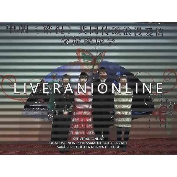 (120103) -- BEIJING, Jan. 3, 2012 () -- Opera performers from China and the Democratic People\'s Republic of Korea (DPRK), who play the leading characters in different opera adaptations of \'the Butterfly Lovers\', a traditional Chinese love tragedy, pose for a group photo when attending a seminar in Beijing, capital of China, Jan. 2, 2012. The two country\'s opera performers, who are from Xiaobaihua Yueju Opera Troupe of east China\'s Zhejiang Province and the Phibada Opera Troupe of the DPRK, both have presented their opera adaptations of \'the Butterfly Lovers\' in China in the past several months. Different styles of singing and dancing were shown to tell the Chinese story about a pair of lovers who turn into butterflies after their love is not blessed by the world. (/Fan Rujun) (ry) ©photoshot/AG ALDO LIVERANI SAS - ITALY ONLY -