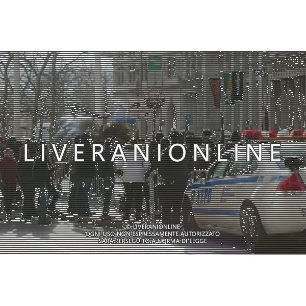 Tourists wait behind police barricades to pose for photos in front of the Wall Street Bull on Broadway in Lower Manhattan in New York on Monday, January 2, 2011. For the last three months the iconic sculpture has been off limits and behind barricades because of fear of vandalism from Occupy Wall Street protesters. At a ceremony celebrating the 22nd anniversary of the bull by artist Arturo DiModica the Bowling Green Assoc. called for the removal of the barricades because they are adversely affecting businesses in the area that rely on tourist trade. (Œ Richard B. Levine) ©PHOTOSHOT/AG ALDO LIVERANI SAS - ITALY ONLY - *** Local Caption *** .