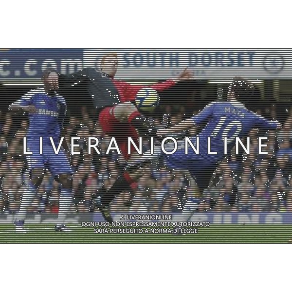 Chelsea\'s Juan Mata shoots under pressure of Portsmouth\'s Dave Kitson Football - FA Challenge Cup Third Round - Chelsea v Portsmouth - Sun 08 Jan 2012 - Stamford Bridge - London © CameraSport - 43 Linden Ave. Countesthorpe. Leicester. England. LE8 5PG - Tel: +44 (0) 116 277 4147 - admin@camerasport.com - www.camerasport.com