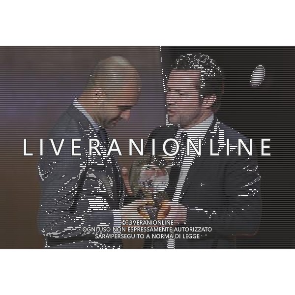 (120110) -- ZURICH, Jan. 10, 2012 () -- Barcelona\'s coach Pep Guardiola (L) receives the FIFA Men\'s Football Coach of the Year Award from German football star Lothar Matthaeus during the FIFA Ballon d\'Or Gala 2011 in Zurich, Switzerland, Jan. 9, 2012. (/Zhou Lei) (jyc) ©PHOTOSHOT/Agenzia Aldo Liverani Sas - ITALY ONLY: ZURIGO - PREMIAZIONE \' PALLONE D\'ORO 2011\'
