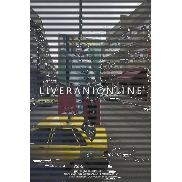 (120117) HOMS, Jan. 17, 2012 () A woman stands in front of a poster of Syrian President Bashar al Assad in the street in Homs, Syria, Jan. 16, 2012. A group of foreign journalists led by Syrian news authority entered Homs on Monday, five days after a group of foreign journalists were attacked by terrorists in the city. (/Li Muzi) (djj) ©PHOTOSHOT/ALDO LIVERANI SAS - ITALY ONLY -