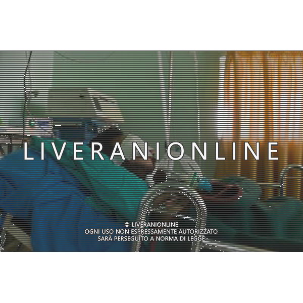 (120117) HOMS, Jan. 17, 2012 () A man injured by armed groups receives treatment at Abdul Qader Shafta hospital in Homs, Syria, Jan. 16, 2012. A group of foreign journalists led by Syrian news authority entered Homs on Monday, five days after a group of foreign journalists were attacked by terrorists in the city. (/Li Muzi) (djj) ©PHOTOSHOT/ALDO LIVERANI SAS - ITALY ONLY -