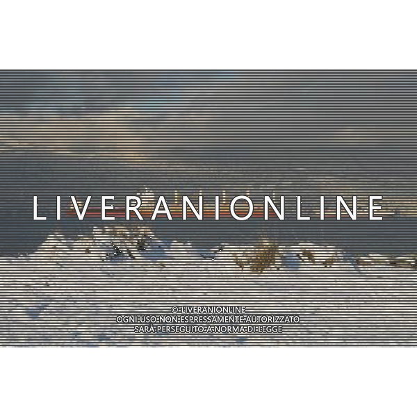 (120118) -- VANCOUVER, Jan. 18, 2011 () -- Photo taken on Jan. 17, 2012 shows the view of the snow on the North Shore mountains, with merchant ships and Jericho beach in the foreground in Vancouver. Environment Canada has issued a snowfall warning for Metro Vancouver, with estimated 20cm of fresh snow to fall on Vancouver overnight. Wind chill caused by a blast of continental arctic air could cause the temperature to drop to -20 degree centigrade in land of Howe Sound in the next few days. (/Sergei Bachlakov) (zyw) ©PHOTOSHOT/AG ALDO LIVERANI SAS - ITALY ONLY