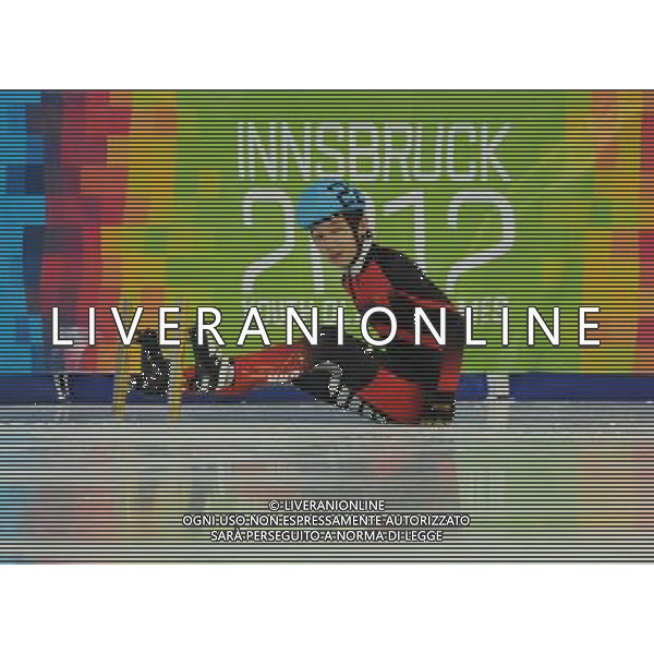 (120119) INNSBRUCK, Jan. 19, 2012 () Lu Xiucheng of China falls off the track during the men\'s 500m short track final at the 1st Winter Youth Olympic Games in Innsbruck, Austria, Jan. 19, 2012. (/Xu Liang) (zc) ITALY ONLY - Austria: Giochi Olimpici della Gioventu\' a Innsbruck