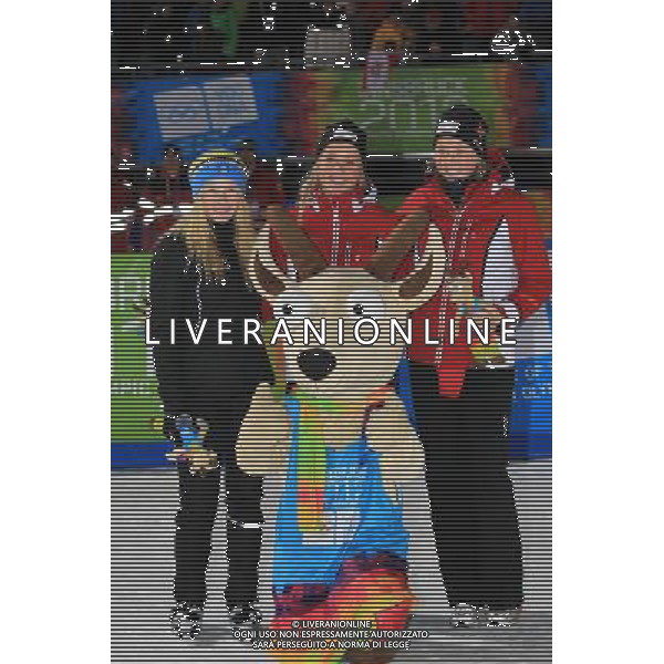 (120120) -- INNSBRUCK, Jan. 20, 2012 () -- Gold medalist Silje Theodorsen (C), her teammate bronze medalist Linn Eriksen (R) and silver medalist Jonna Sundling of Sweden celebrate with mascot Yoggl after Cross country Skiing ladies\' sprint free event at the Innsbruck 2012 Youth Olympic Games in Innsbruck, Austria, Jan. 19, 2012. Silje Theodorsen won the gold medal with 1 minutes 57.4 seconds. (/Bai Xuefei)(dlq) ITALY ONLY - Austria: Giochi Olimpici della Gioventu\' a Innsbruck