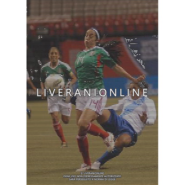 (120121) -- VANCOUVER, Jan. 21, 2012 () -- Renae Cuellar (Front) of Mexico is tackled by Amarilis Lohaiza of Guatemala during their match at the 2012 CONCACAF Women\'s Olympic Qualifying Soccer Tournament in Vancouver, Canada, Jan. 20, 2012. Mexico defeated Guatemala 5-0. (/Sergei Bachlakov) ©photoshot/Agenzia Aldo Liverani Sas - ITALY ONLY - Partita di qualificazione del torneo olimpico di calcio femminile 2012 CONCACAF a Vancouver, Canada 20 gennaio 2012.