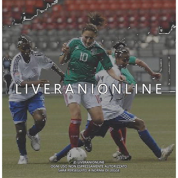 (120123) VANCOUVER, Jan. 23, 2012 () Dinora Garza(2nd, L) of Mexico breaks through during the match against Dominican Republic at the Day 4 of 2012 CONCACAF Women\'s Olympic Qualifying Soccer Tournament at BC Place in Vancouver, Canada, Jan. 22, 2012. Mexico defeated Dominican Republic 7 0 in a dominant performance. (/Sergei Bachlakov) ©photoshot/Agenzia Aldo Liverani Sas - ITALY ONLY - MESSICO - REPUBBLICA DOMINICANA Partita di qualificazione del torneo olimpico di calcio femminile 2012 CONCACAF a Vancouver, Canada 22 gennaio 2012.