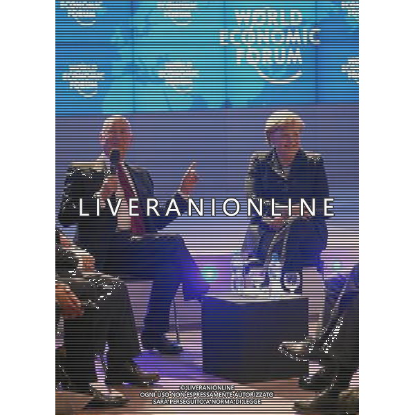 (120125) -- DAVOS, Jan. 25, 2012 () -- Klaus Schwab, founder and executive chairman of the World Economic Forum (WEF), talks with German Chancellor Angela Merkel at the opening of the Annual Meeting 2012 of the World Economic Forum at the congress centre in Davos, Switzerland, January 25, 2012. The Meeting this year, which takes place from Jan. 25 to Jan. 29, will convene under the theme of the Great Transformation: Shaping New Models. (/World Economic Forum/Remy Steinegger) (Editorial Use Only, No Commercial Use, No Archive, Not For Sale) ©PHOTOSHOT/ALDO LIVERANI SAS - ITALY ONLY - 42ma riunione annuale del World Economic Forum (WEF), a Davos, in Svizzera, il 25 gennaio 2012.