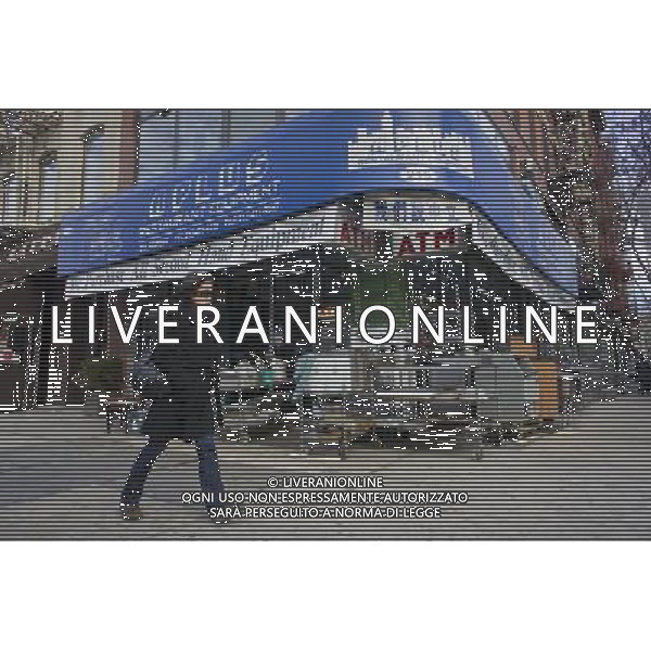 A woman walks past a restaurant supply seller on the changing Bowery in New York on Saturday, January 28, 2012. © RICHARD B. LEVINE - photoshot - ag. aldo liverani sas italy only VEDUTE DI NEW YORK