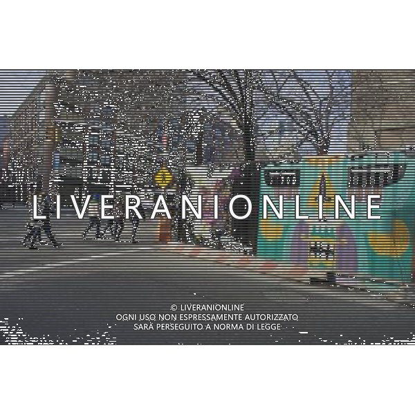 Pedestrians pass construction containers at East Fourth Street and the Bowery decorated with graffiti style street art in the trendy East Village neighborhood of New York on Saturday, January 28, 2012. © RICHARD B. LEVINE - photoshot - ag. aldo liverani sas italy only VEDUTE DI NEW YORK