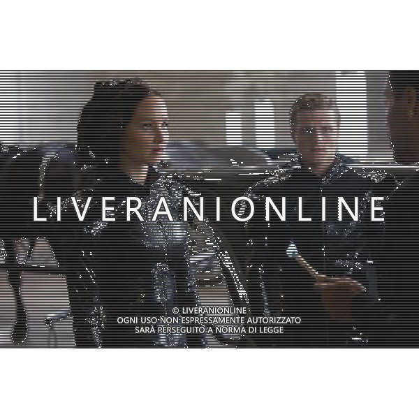 Katniss Everdeen (Jennifer Lawrence, left), Peeta Mellark (Josh Hutcherson, center) and Cinna (Lenny Kravitz, right) in THE HUNGER GAMES. AG ALDO LIVERANI S A S ONLY ITALY